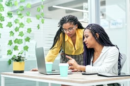 two-young-black-women-reviewing-analytical-data-on-2022-01-19-00-10-18-utc